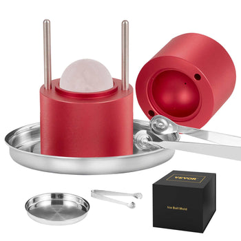 Red aluminum ice ball mold set with stainless steel tongs, tray, and round ice maker for perfect spheres.