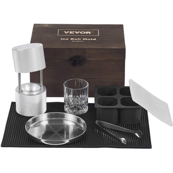 Silver aluminum ice ball mold set with black silicone mold, glass tumbler, stainless steel tray, and wooden box.