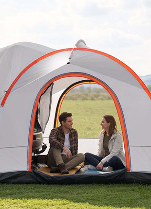 Gray and orange pop-up camping tent with an open entrance, ideal for outdoor relaxation, featuring two people inside.