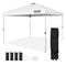 White pop-up canopy tent with silver frame, includes black carrying case, weight bags, stakes, and ropes.