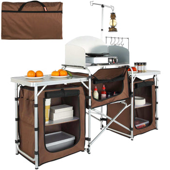 Brown foldable camping kitchen table with storage, integrated grill, and hanging rack, perfect for outdoor cooking.