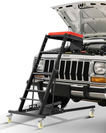 Black rolling mechanics stool with a red padded seat and sturdy metal frame, ideal for auto repairs and maintenance.