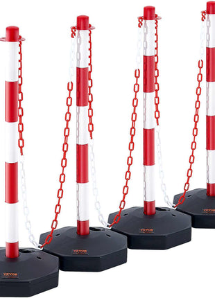 Red and white striped retractable safety barrier posts with black bases and white chains, ideal for crowd control.