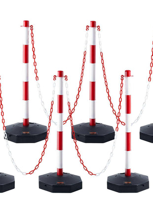 Red and white striped retractable barrier poles with black bases and linked chains, ideal for crowd control and event management.