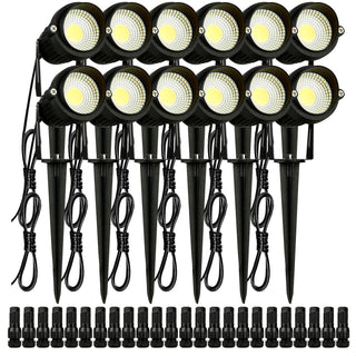Set of 12 black LED garden spotlights with yellow bulbs, adjustable stakes for outdoor illumination.