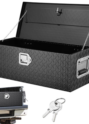 Black diamond plate aluminum truck tool box with lock and keys, designed for durability and secure storage.