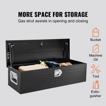 Black diamond-plate storage chest with gas strut lid, ideal for tools and equipment, measures 13 inches high.