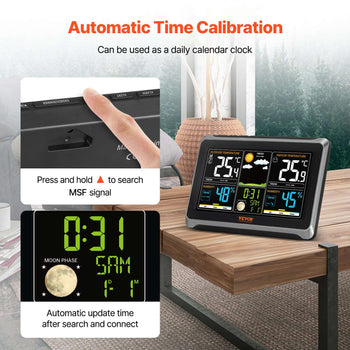 Black digital clock with automatic time calibration, displaying temperature, moon phase, and date, on a wooden table.