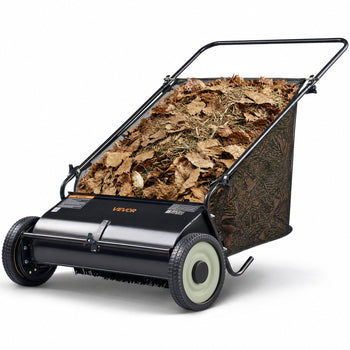 Black yard leaf vacuum with a large basket filled with brown leaves, ideal for efficient garden cleanup.