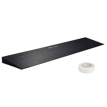 Black rubber threshold ramp with ridges and included clear adhesive tape for secure installation. Ideal for smooth transitions.