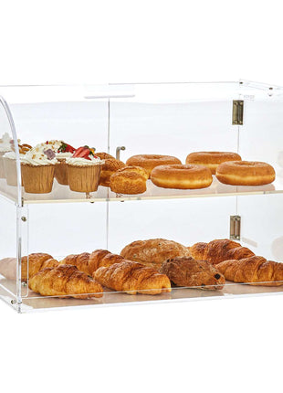 Clear acrylic display case with curved lid, showcasing assorted pastries including donuts, croissants, and cupcakes.