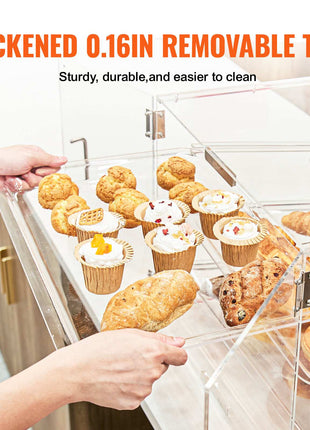 Clear acrylic display with removable 0.16in tray, showcasing assorted pastries and desserts on a sleek countertop.