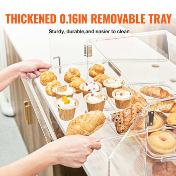 Clear acrylic display with removable 0.16in tray, showcasing assorted pastries and desserts on a sleek countertop.