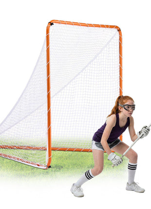 Youth lacrosse goal, orange metal frame, white net, girl in purple tank top and gray shorts, ready to catch.